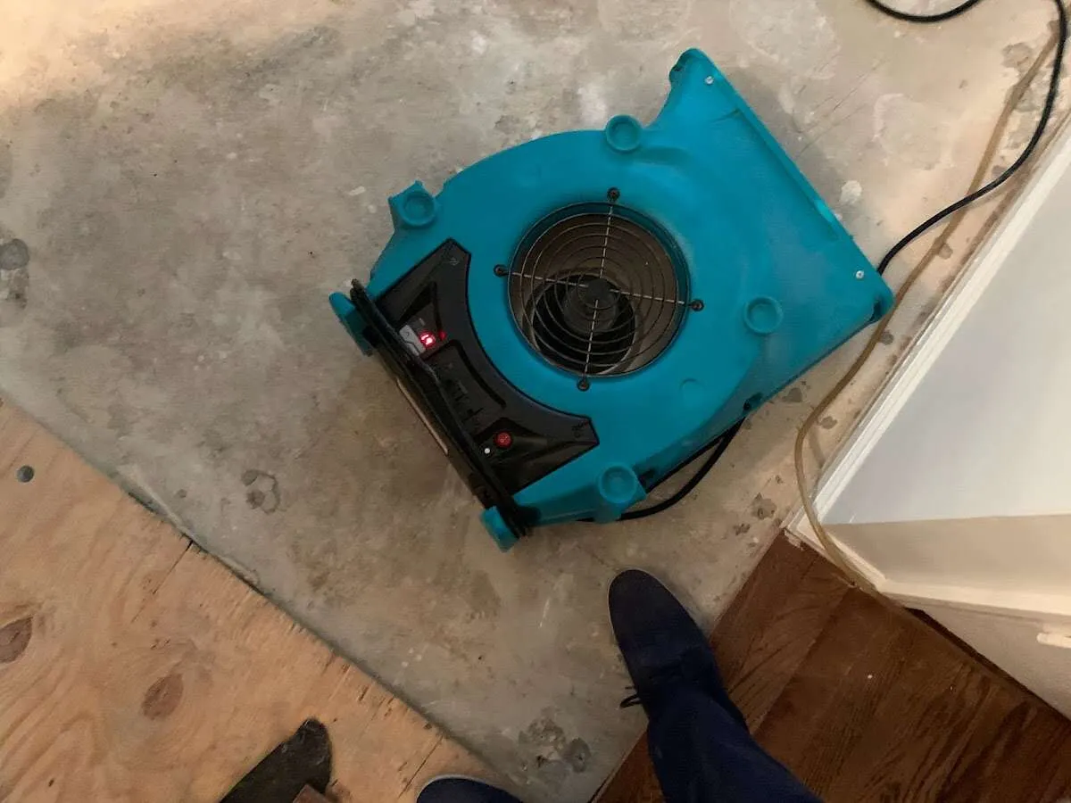Air mover drying subfloor during Commercial Water Damage Restoration in The Dalles